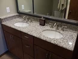 It is illuminated by chrome sconces and recessed ceiling lights. Tiger Skin Granite Countertops Modern Bathroom Cedar Rapids By Primotops Llc Houzz