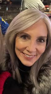 Who designed Melissa Gorga's red dress?