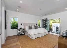 Inspiration for a large timeless master ceramic tile and beige floor bedroom remodel in san francisco with gray walls and a hanging fireplace wood look plank tile, but in shades of beige. 75 Beautiful Medium Tone Wood Floor Bedroom Pictures Ideas April 2021 Houzz