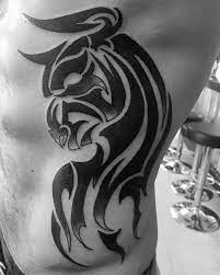 Rib tattoos are extremely popular and you can get designs from a small quote to elaborate pictures. Top 40 Best Tribal Rib Tattoos For Men Manly Ink Design Ideas