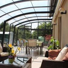Abri De Terrasse Coulissant Et Veranda Retractable Aluminium Sur Mesure Juralu Abri Terrasse Veranda Retractable Veranda Terrasse
