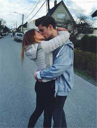 A happy teen couple sitting beside each other with a stone building in the background. 30 Adorable Teen Couple Goals For Your Teenage Dream Women Fashion Lifestyle Blog Shinecoco Com
