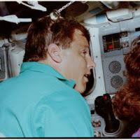 TECH. SGT. Rudy Lane, left, an airborne radar technician; CAPT. Thomas  Thibodeau, center, an airborne remote control officer (ARCO); and Carl  Goetzinger, the launch control officer, man their stations aboard a DC-130H