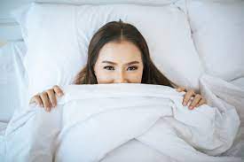 Then, slip on a pair of thick fluffy socks to keep the lotion from getting onto your bed sheets.5 x research source. Free Photo Beautiful Woman Waking Up In Her Bed Lazy In The Morning