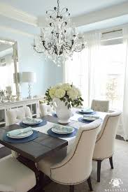 White Hydrangea Arrangement In Formal Dining Room With Crystal Chandelier Homedecorideas Dining Room Updates Mirror Dining Room Dining Room Blue