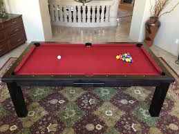 Looking quite traditional in style, this pool table also becomes a dining table thanks partly to the design of the base. Pool Dining Tables Neon Pool Tables