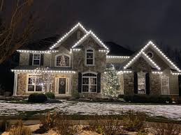 A measuring tape is used to measure a window on the exterior of a home for accurate fitting of christmas string lights. Window Genie Of Cleveland West Fairview Park Oh Window Cleaning Mapquest