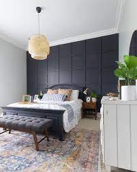 The modern master bedroom might be an en suite (with a bathroom attached), the largest bedside task lighting is key for reading in bed, accent lighting on shelving or in closets highlights wherever you want, and a bedding is an easy and fun way to update the master bedroom with little commitment. Bedroom Black Grid Accent Wall Mid Century Modern Bedroom Vintage Rug Ikea Basket Light B Contemporary Bedroom Design Remodel Bedroom Master Bedroom Design