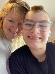 What do you think of Travis Kelce's new haircut and overall look?