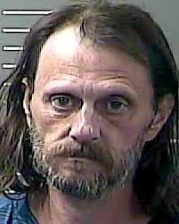 Lawrence man charged with shooting wife