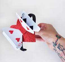 Step 2 using the white paper as a guide, start placing the cards around the neck area and staple them together. How To Make A Twisted Alice In Wonderland Hair Accessory With Playing Cards Now Thats Peachy