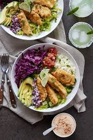 They have a great salsa bar with sliced cucumber, onion, cilantro, lettuce and a bunch of different hot sauces and also sriracha mayo, and baja tacos special white seafood taco sauce. Grain Free Baja Fish Taco Bowl Paleo Friendly Tasty Yummies