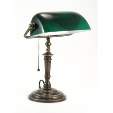 A small brass oil lamp used on a desk, also called a student's lamp. Traditional Solid Brass Bankers Lamp Green Glass Shade Pull Switch
