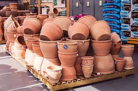 Large outdoor ceramic planters are preferable to clay pots when starting seeds, as they retain moisture more consistently. Garden Pots Bernaville Nurseries