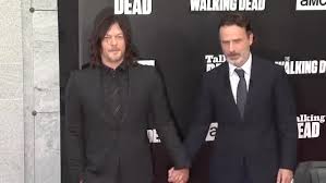 Andrew lincoln norman reedus hold hands at walking dead premiere