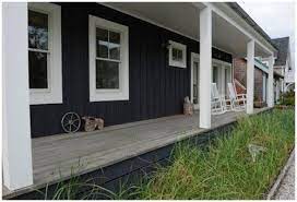 Dark blue paint with wood garage door and white trim. Navy Blue House House Exterior Blue House Exterior House Colors