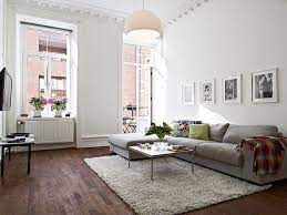 White colored stacked stone fireplace with grey walls and blue accent pillows done in a contemporary style. Pin By Anna Tran On Deco And Nice Warm Home Decor Wooden Floors Living Room Living Room Interior