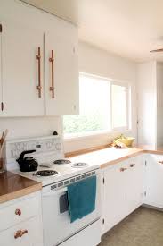 Home Copper And White Kitchen Makeover Reveal Squirrelly Minds White Kitchen Makeover Kitchen Cabinets Kitchen Cabinet Hardware