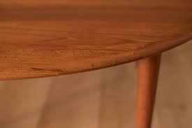 Its distinctive tabletop provides a stable and secure surface on which you can place your drinks, vases, fruit bowls, or ornaments. Mid Century Solid Teak Coffee Table By Peter Hvidt Orla Molgaard Nielsen Mid Century Maddist