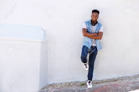 One of many great free stock photos from pexels. Full Body Portrait Of Happy Young Man Leaning Against Wall With Headphones Stock Photo Picture And Royalty Free Image Image 77791584