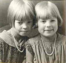 Veda Tebbs (left) and another Panguitch art student painting a fall-themed  mural as Mr. Harvey Moore looks