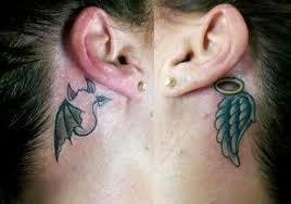 Devil and angel whispering in ear tattoo. Angel Devil Behind Ear Tattoos