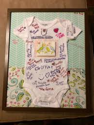 Onesie Guest Sign In That I Made For My Cousin S Baby Shower Background Is Wrapping Paper And The Pieces Of C Baby Shower Guest Baby Shower Baby Shower Onesie