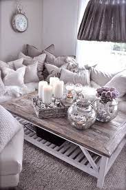 Table centerpieces that are created with simple and cheap decorations, candles, house plants, sea shells, driftwood pieces or books, add a relaxing decorative candles are great centerpiece ideas and perfect additions to any coffee table decoration. 20 Super Modern Living Room Coffee Table Decor Ideas That Will Amaze You Silver Living Room Table Decor Living Room Purple Living Room