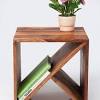 The dark brown finish add depth to its wooden texture, showcasing a great piece of artistry. 1