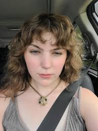 My wife wants Bangs but wants to see how it would look first. Can any of  you talented individuals do anything here?