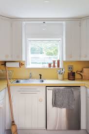 Diy host amy matthews uses a vacuum to clean out the cabinets before painting them. Expert Tips On Painting Your Kitchen Cabinets