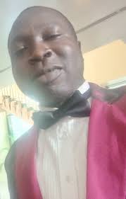 What is the name of the school opposite Divine Favor College Omuma?