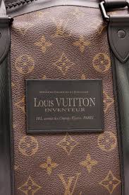 Black And White Louis Vuitton Duffle Bag The Black Trim On This Waterproof Louis Vuitton Keepall Adds Some Edge And Practicality To Your Travel Style Louis Vuitton Vuitton Louis Vuitton Handbags