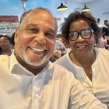 Mr. Ira Poole, longtime resident of East Austin's Rogers-Washington-Holy  Cross neighborhood, and his beloved palomino horse Playboy. Mr. Poole was a  lifelong educator with Austin ISD. In the 1970s, he began decorating