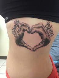Getting hand tattoos is a matter of making bold and rebellious style statement. Tattoo My Kids Hand Portrait With Their Names Above Their Hands Heart Tattoos For Kids Tattoos Tattoos And Piercings