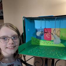 We came home to find Katie's Harry Potter diorama almost finished. Look  closely: her quidditch pitch has broomsticks that required our Great Pyr to  sacrifice some of her fur... #potterhead #quidditch #shesaravenclaw #