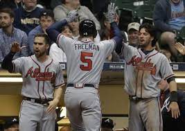 Atlanta Braves Freddie Freeman Is Congratulated After Hitting A Two Run Home Run During The Ninth Inning Of A Baseball Ga Baseball Games Braves Atlanta Braves