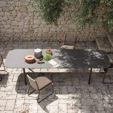 Patio dining tables represent a traditional and timeless outdoor furnishing, suitable for anchoring any furniture arrangement. Contemporary Dining Table Piper 030 Roda Stainless Steel Stone Rectangular