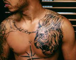 In addition to that, the words 'still i rise' runs across his shoulder blades. Lewis Hamilton Shows Off New Lion Tattoo On Instagram Hello