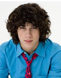 Nick Jonas with long curly hairstyle.PNG