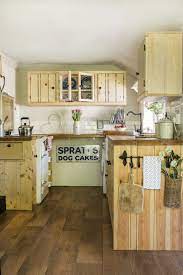 To play up this delicate beauty and sense of tradition, the top of the island of the reclaimed rustic old pine kitchen island has been simply protected with a clear coating. Real Home Centuries Old Cottage Full Of Vintage Finds And Timeless Rustic Style Small Cottage Kitchen Cottage Kitchen Old Cottage