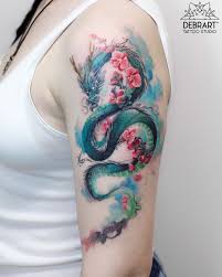 Random claw sketching #japanesedragon #art #dragon #dragontattoo #japanesetattoo #japaneseart #tattoo #asiandragon. Dragon Arm Tattoo On The Shoulder Watercolor Tattoo Blue Green Dragon Pink Blooming Flowers Dragon Sleeve Tattoos Dragon Tattoo For Women Sleeve Tattoos