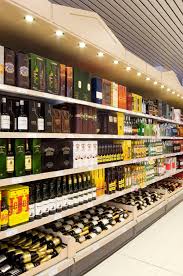 Supermarket Sklabeniths Sthn Kalli8ea Designed By Voyatzoglou Systems Store Design Liquor Store Wine Rack