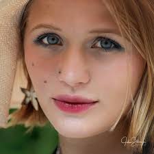 What is the significance of the comma and period at the studio?