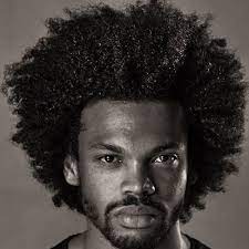 Medium black hairstyle with curls. The Best Curly Hairstyles For Black Men In 2021