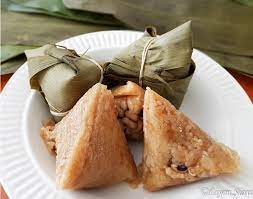 The three most common activities of the dragon boat festival include eating and preparing zongzi, a traditional chinese food made from a sticky sweet rice stuffed with various types of fillings then. Eating Zongzi At Dragon Boat Festival Liyen S Foodmoments