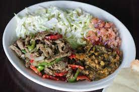Muufo Platter Beef Suqaar Spinach Mix Salad Served With Muufo Picture Of Xawaash Toronto Tripadvisor