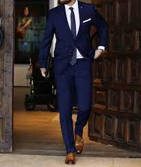 Men's navy vertical striped blazer, white and blue dress shirt, brown plaid wool tie, charcoal pocket square. Top Instagram Outfits For The Office Fashion Suits For Men Suits Men Business Blue Suit Men