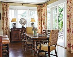 It has a dark wood dining set fitted with white cushions along with a pair of brown it has glass windows covered with perforated blinds and white sheer curtains. Lovely Mountain Summer Home With Terrific Color Home Traditional Dining Rooms Traditional Formal Dining Room