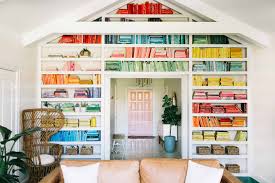 Make a diy bookcase to that is strong, fits your space, and makes for a beautiful display in your home. Elsie S Rainbow Bookshelves A Beautiful Mess